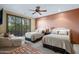 Spacious bedroom with two queen beds and access to balcony at 9673 E Oberlin Way # 15, Scottsdale, AZ 85262