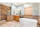 Spa-like bathroom with soaking tub, walk-in shower, and updated vanity at 6964 E Redbird Rd, Scottsdale, AZ 85266