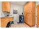 Laundry room with washer, dryer, and ample cabinet space at 6964 E Redbird Rd, Scottsdale, AZ 85266