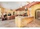Island kitchen with open floor plan to living room at 6964 E Redbird Rd, Scottsdale, AZ 85266
