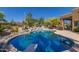 Inviting kidney-shaped pool with diving board at 6964 E Redbird Rd, Scottsdale, AZ 85266