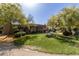 Spacious backyard featuring a large lawn and mature trees, perfect for relaxation at 6964 E Redbird Rd, Scottsdale, AZ 85266