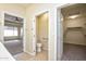 Bathroom with toilet and access to walk-in closet at 21853 N 261St Ave, Buckeye, AZ 85396