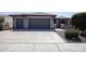 Two-car garage and front yard landscaping at 21853 N 261St Ave, Buckeye, AZ 85396