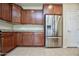Kitchen with stainless steel refrigerator and ample cabinetry at 21853 N 261St Ave, Buckeye, AZ 85396