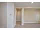 Bright hallway with neutral walls and tile flooring at 21853 N 261St Ave, Buckeye, AZ 85396