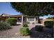 Back exterior view of house with desert landscaping at 21853 N 261St Ave, Buckeye, AZ 85396