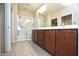 Double vanity bathroom with large shower and tile floor at 21853 N 261St Ave, Buckeye, AZ 85396