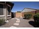 Backyard access with stone path and gravel at 21853 N 261St Ave, Buckeye, AZ 85396