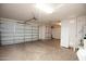 Two-car garage with extra storage cabinets at 21853 N 261St Ave, Buckeye, AZ 85396