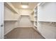 Large walk-in closet with ample shelving and hanging space at 21853 N 261St Ave, Buckeye, AZ 85396