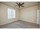 Bright bedroom with ceiling fan and window blinds at 21853 N 261St Ave, Buckeye, AZ 85396
