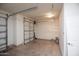 Garage featuring storage cabinets and a door at 21853 N 261St Ave, Buckeye, AZ 85396