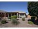 Back exterior view of house with desert landscaping at 21853 N 261St Ave, Buckeye, AZ 85396