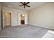 Spacious bedroom with carpet flooring and ensuite bathroom access at 21853 N 261St Ave, Buckeye, AZ 85396