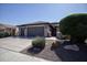 Two-car garage and desert landscaping at 21853 N 261St Ave, Buckeye, AZ 85396