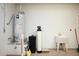 Basement laundry room with utility sink, water softener, and water heater at 21853 N 261St Ave, Buckeye, AZ 85396