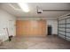 Spacious garage with overhead storage at 21853 N 261St Ave, Buckeye, AZ 85396