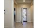 Tiled entryway with security system and views to the living room at 21853 N 261St Ave, Buckeye, AZ 85396