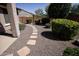 Landscaped backyard with stone path and desert landscaping at 21853 N 261St Ave, Buckeye, AZ 85396