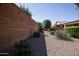Landscaped backyard with gravel, rock features, and desert plants at 21853 N 261St Ave, Buckeye, AZ 85396