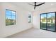 Bright bedroom with sliding glass doors leading to the backyard at 8509 S 10Th Ln # 23, Phoenix, AZ 85041