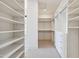 Large walk-in closet with ample shelving and drawers at 8509 S 10Th Ln # 23, Phoenix, AZ 85041