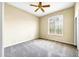 Bright bedroom with neutral carpeting and plantation shutters at 8196 E Sunnyside Dr, Scottsdale, AZ 85260