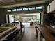 Open living space with sliding glass doors leading to backyard pool at 5755 S Joshua Tree Ln, Gilbert, AZ 85298