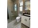 Clean bathroom with patterned floor and walk-in shower at 5755 S Joshua Tree Ln, Gilbert, AZ 85298
