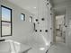 Luxurious bathroom with a large walk-in shower and soaking tub at 5755 S Joshua Tree Ln, Gilbert, AZ 85298