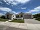 Beautiful home with a two-car garage and manicured lawn at 5755 S Joshua Tree Ln, Gilbert, AZ 85298