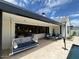 Covered patio with seating area and access to the pool at 5755 S Joshua Tree Ln, Gilbert, AZ 85298