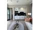 Convenient wet bar with white cabinets and black countertops at 5755 S Joshua Tree Ln, Gilbert, AZ 85298