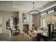 Bright and airy living room with a cozy fireplace and comfortable seating at 5755 S Joshua Tree Ln, Gilbert, AZ 85298