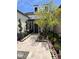 Elegant front entry with landscaped walkway and modern lighting at 5755 S Joshua Tree Ln, Gilbert, AZ 85298