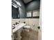 Chic powder room with white shiplap and modern fixtures at 5755 S Joshua Tree Ln, Gilbert, AZ 85298