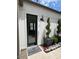 Modern home exterior with a stylish front door and landscaping at 5755 S Joshua Tree Ln, Gilbert, AZ 85298