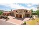 Luxury home with large yard, desert landscaping, and brick driveway at 6215 E Turquoise Ave, Paradise Valley, AZ 85253