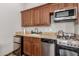 Small kitchenette with microwave and stovetop at 6215 E Turquoise Ave, Paradise Valley, AZ 85253