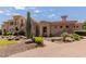 Impressive Spanish-style home with a large front yard and mature trees at 6215 E Turquoise Ave, Paradise Valley, AZ 85253