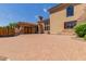 Elegant home exterior with paver driveway and gated entry at 6215 E Turquoise Ave, Paradise Valley, AZ 85253