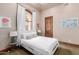 Bright bedroom with a queen-size bed and natural light at 6215 E Turquoise Ave, Paradise Valley, AZ 85253