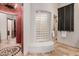 Walk-in shower with glass block feature and built-in seat at 6215 E Turquoise Ave, Paradise Valley, AZ 85253