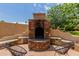 Stone fire pit with seating, perfect for outdoor gatherings at 6215 E Turquoise Ave, Paradise Valley, AZ 85253