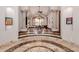 Elegant dining room with hardwood floors, a large table and access to the outdoors at 6215 E Turquoise Ave, Paradise Valley, AZ 85253