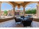 Covered patio with seating area overlooking the pool at 6215 E Turquoise Ave, Paradise Valley, AZ 85253
