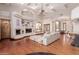Spacious living room with hardwood floors, a large sectional sofa, and a fireplace at 6215 E Turquoise Ave, Paradise Valley, AZ 85253