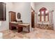 Large bathroom with double vanity, soaking tub, and separate shower at 6215 E Turquoise Ave, Paradise Valley, AZ 85253