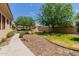Pathway leads to a covered patio and grassy area at 6215 E Turquoise Ave, Paradise Valley, AZ 85253